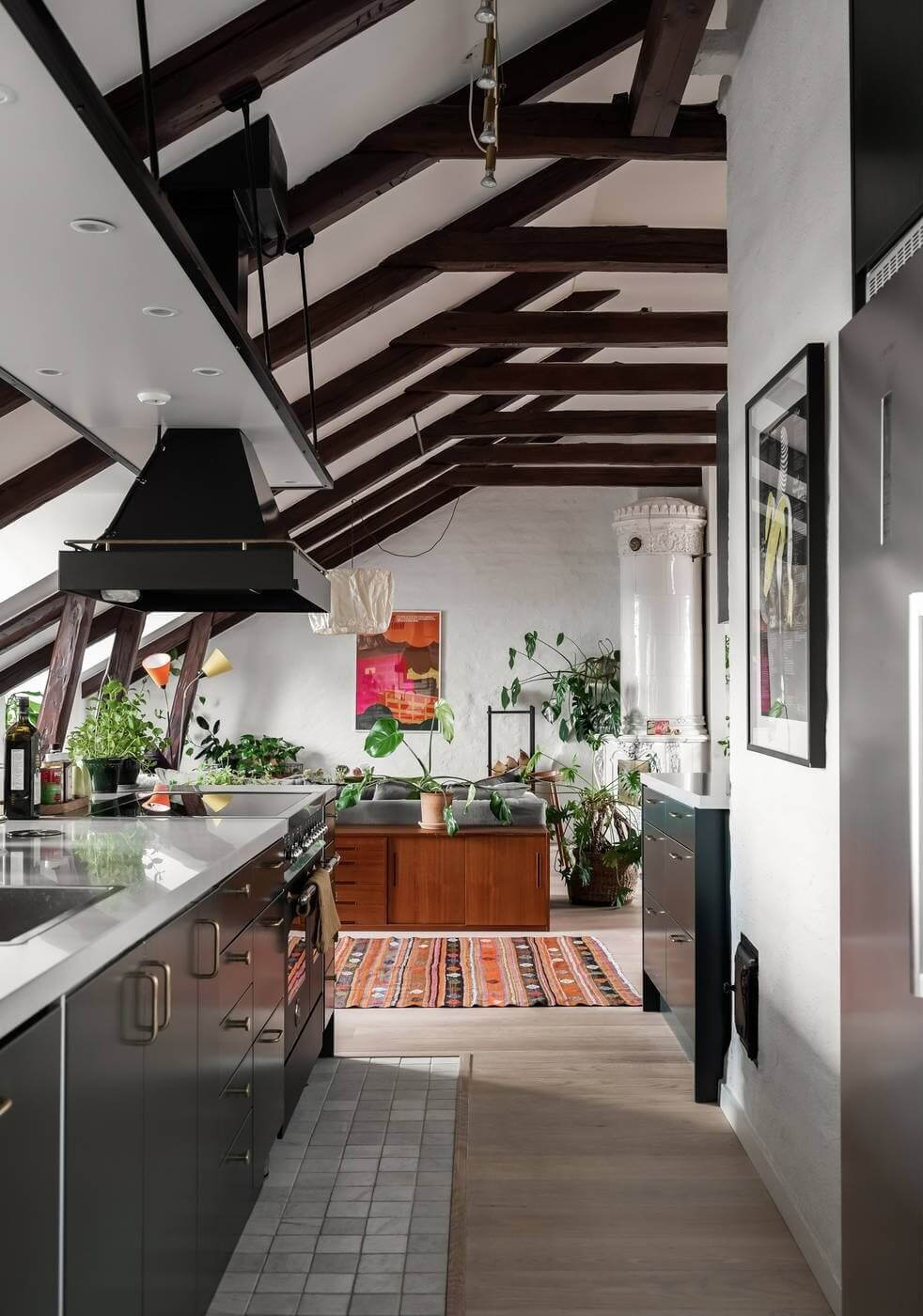 AScandinavianPenthouseApartmentwithaGreenKitchen TheNordroom1 A Scandinavian Penthouse Apartment With A Dark Green Kitchen