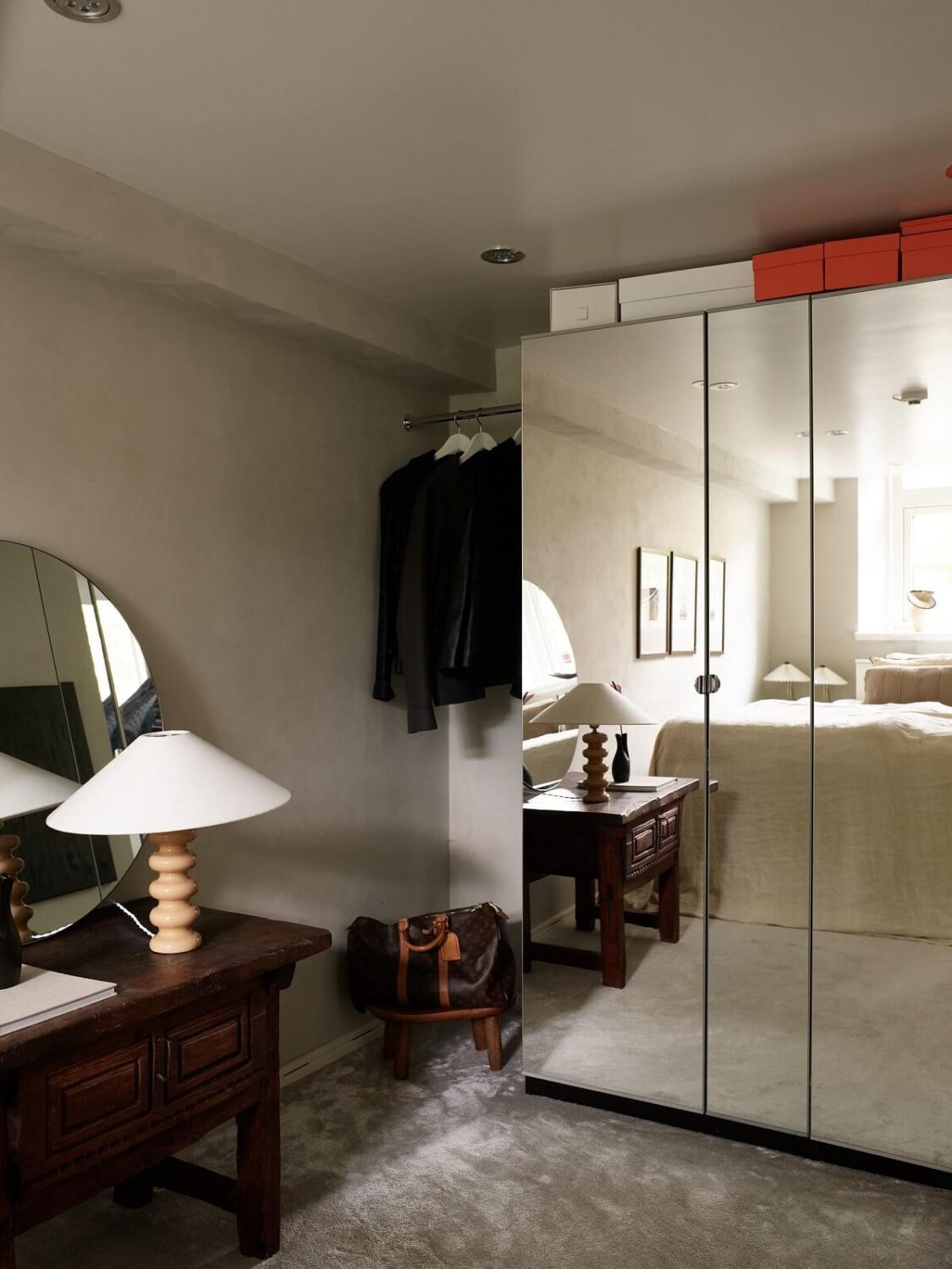 basement bedroom with mirrored wardrobes