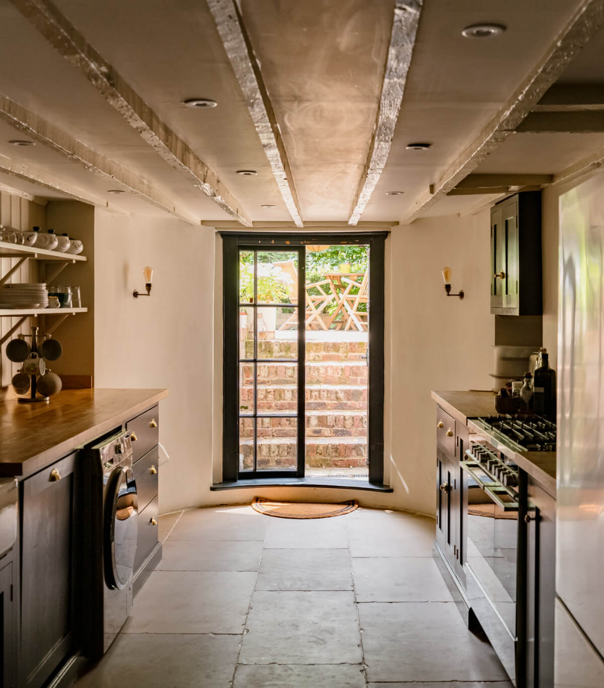 basement kitchen stone floor garden doors