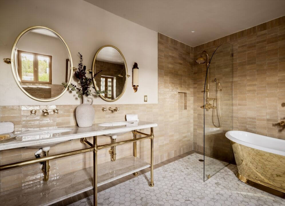 bathroom double shower and sinks gold tub