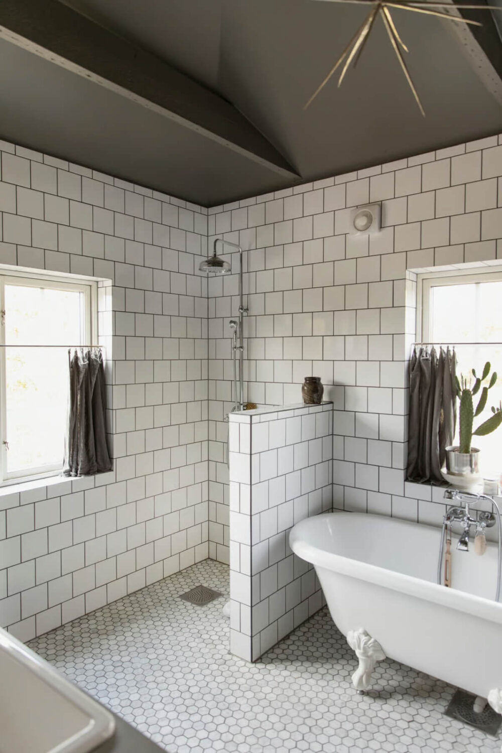 bathroom freestanding bath white tiles gray ceiling nordroom