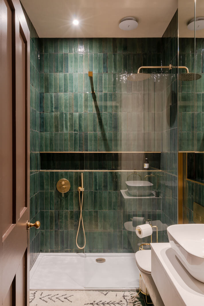bathroom green shower tiles brass fittings
