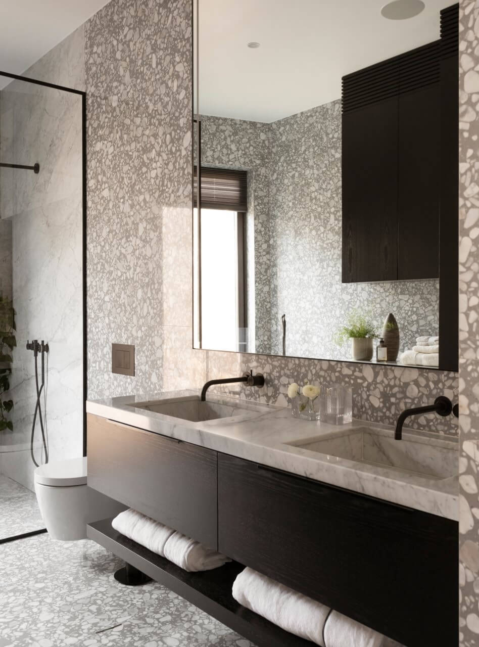 bathroom with black vanity cabinets