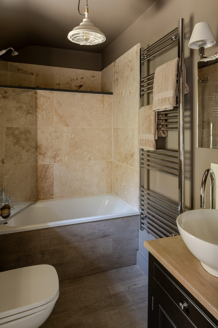 bathroom with combined shower and bath