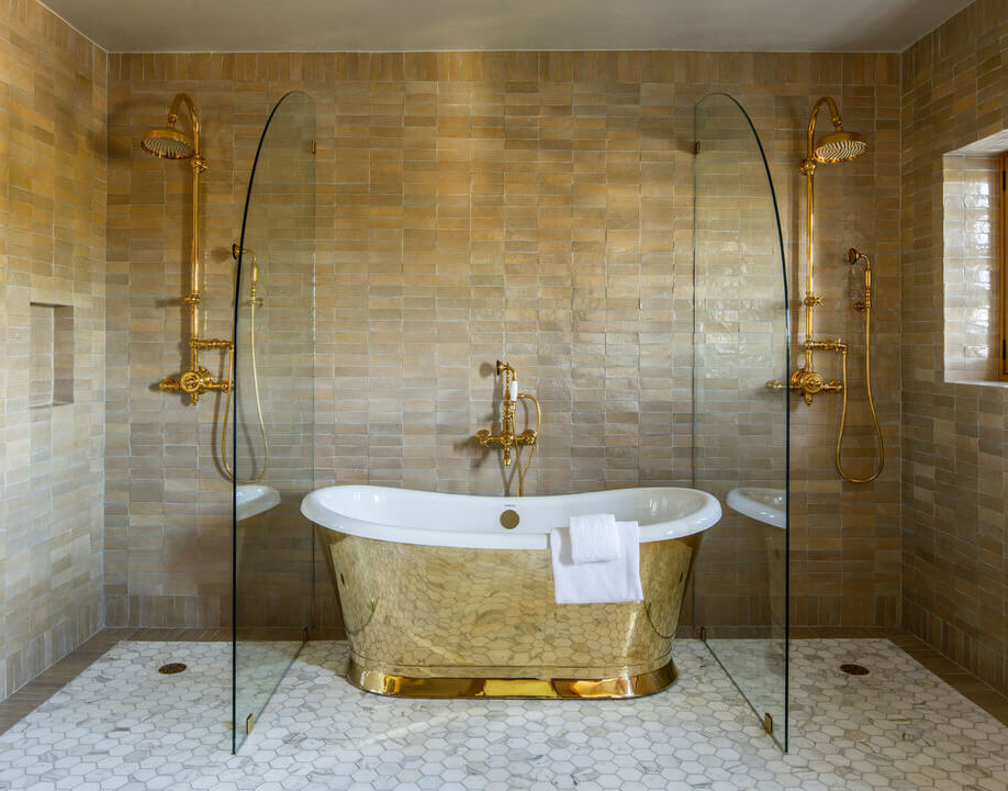 bathroom with gold tub