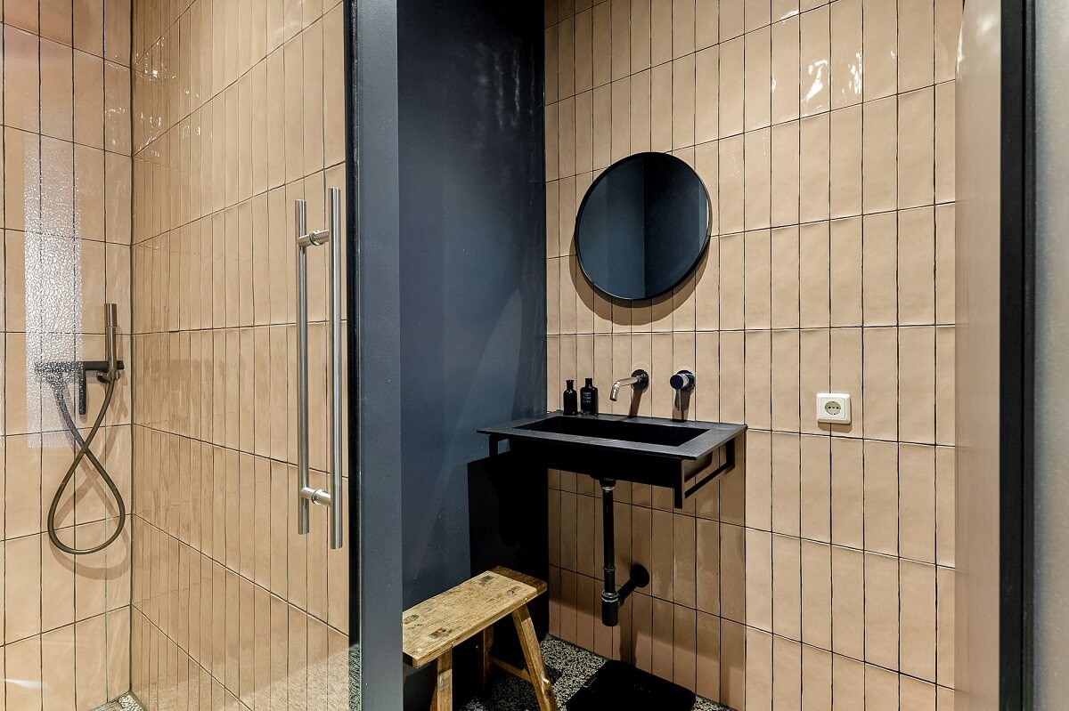 bathroom with light pink tiles