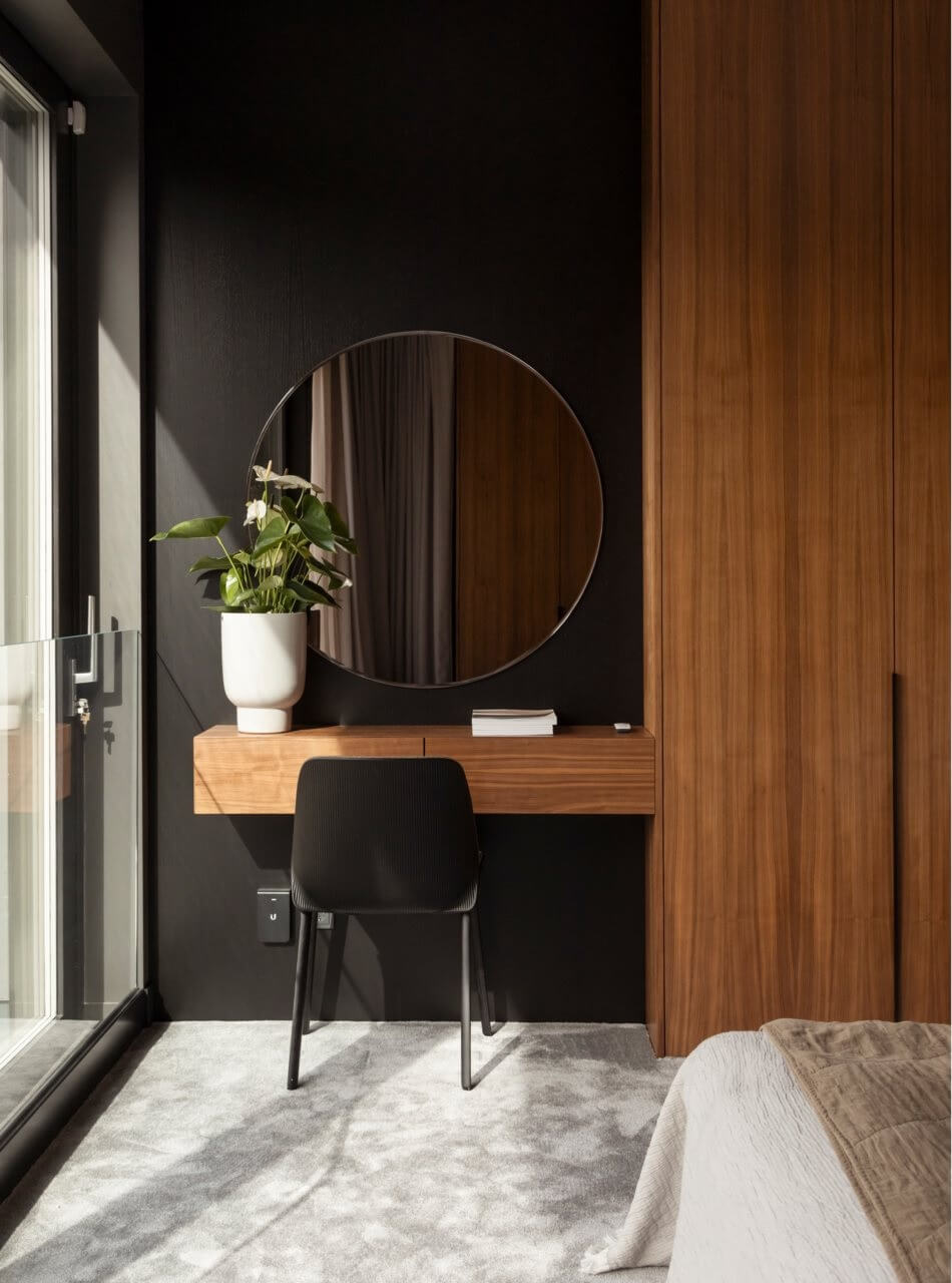 bedroom black wall and floating vanity desk with round mirror nordroom