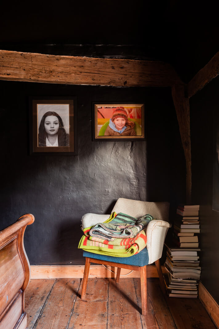 bedroom black walls ceiling wooden beams