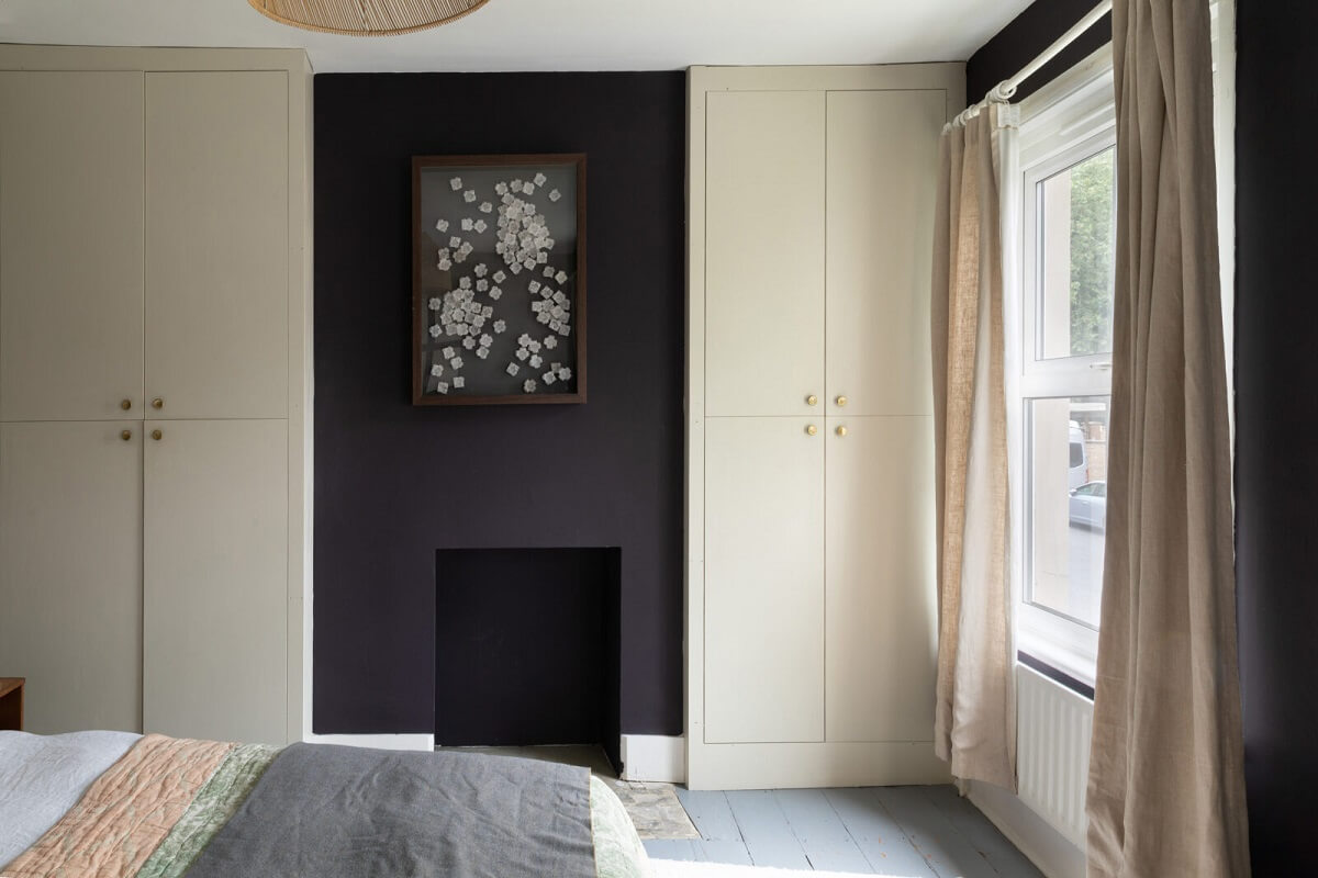 bedroom with black accent wall
