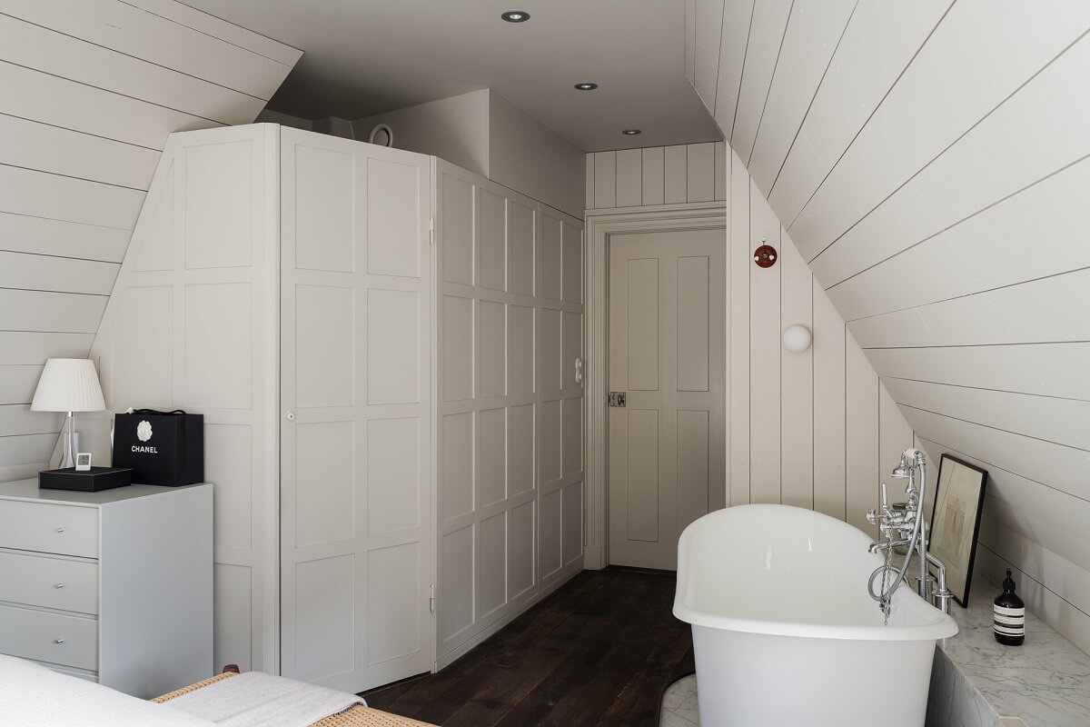 bedroom with freestanding bath walk in closets