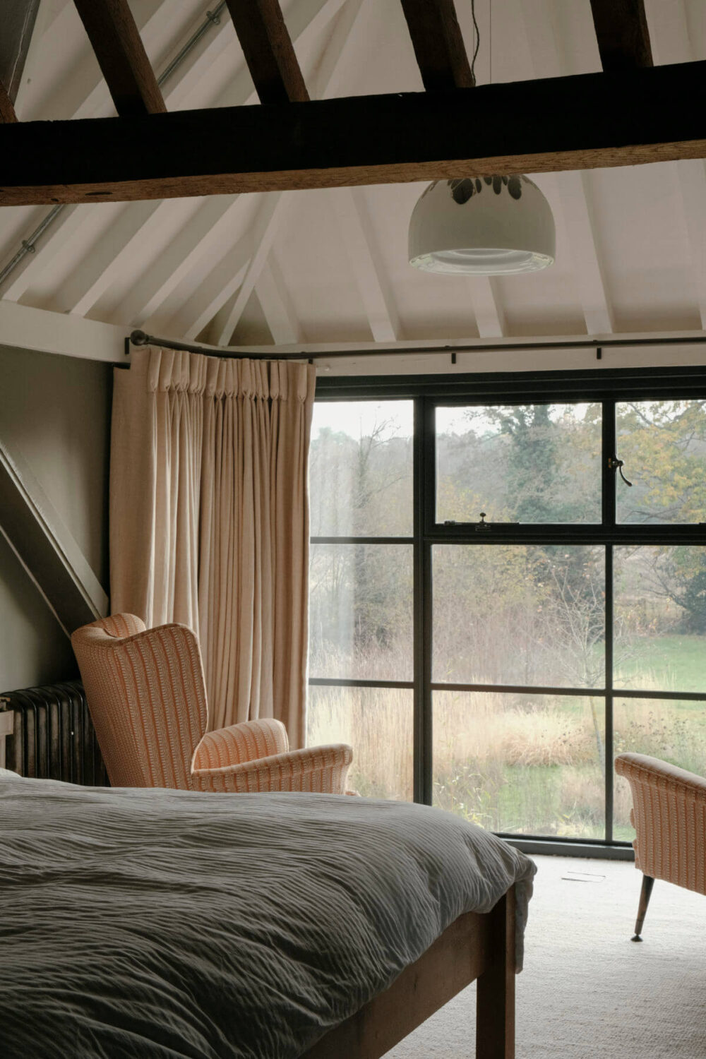 bedroom with pitched ceiling and exposed beams