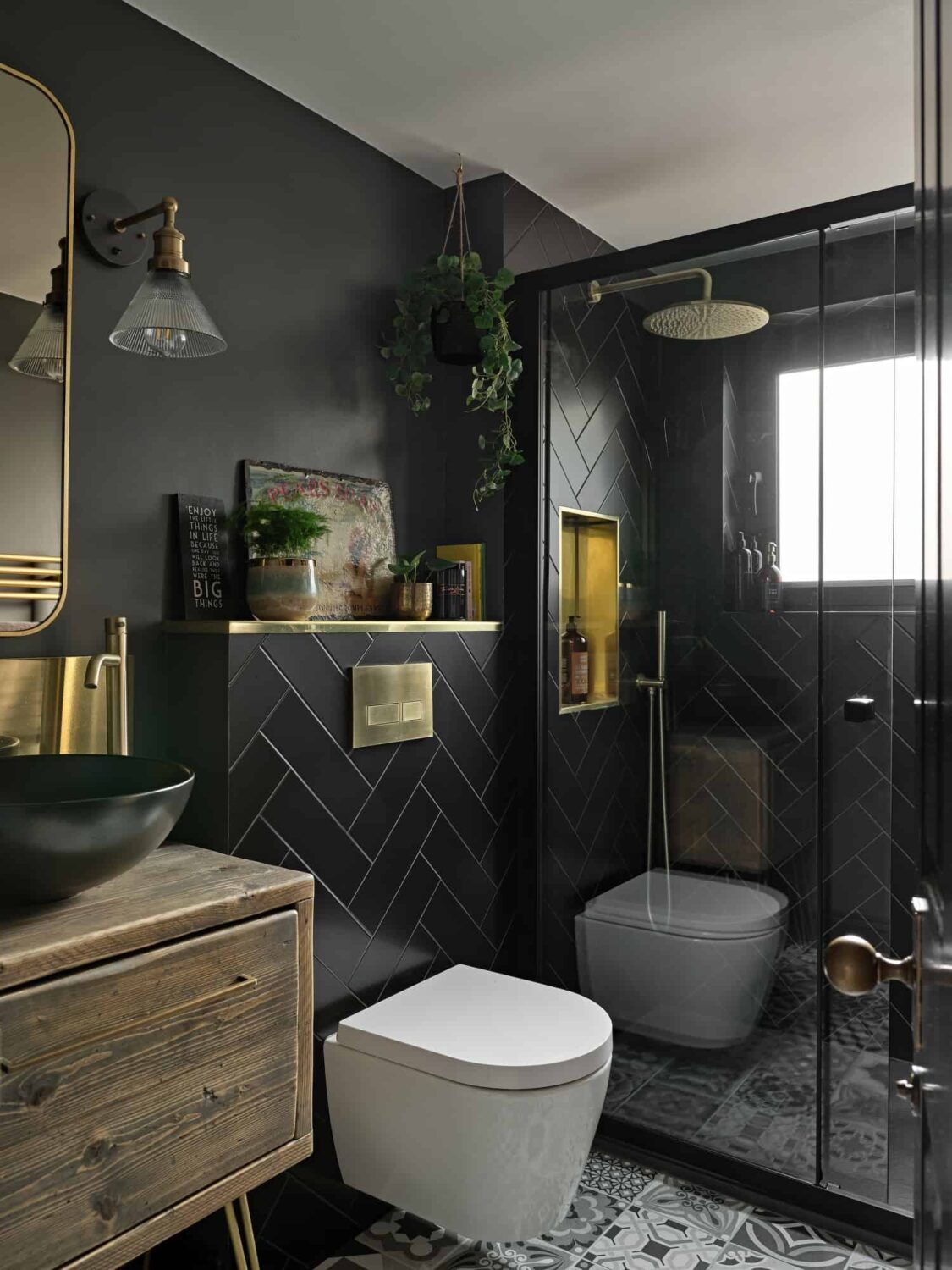 black bathroom with herringbone tiles