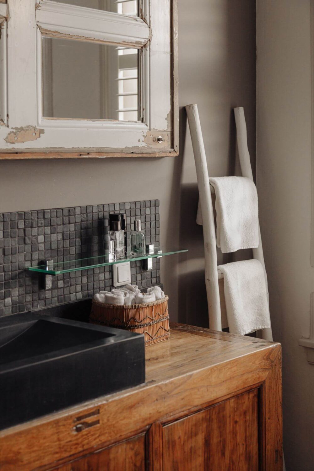 black sink and wooden vanity