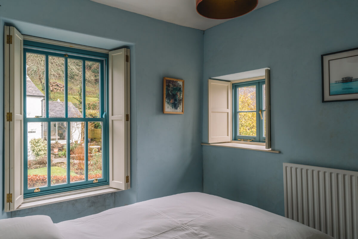 blue bedroom with blue window frames