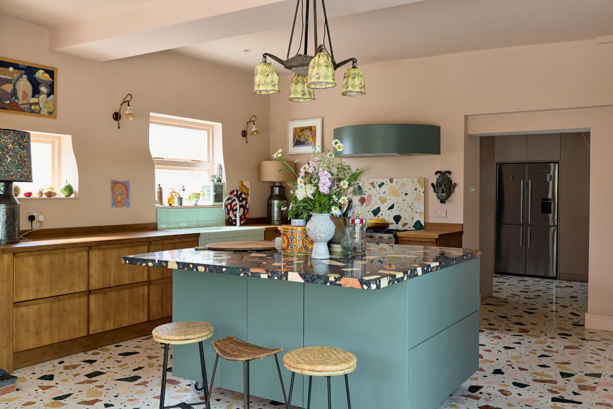 blue kitchen island with terrazzo top