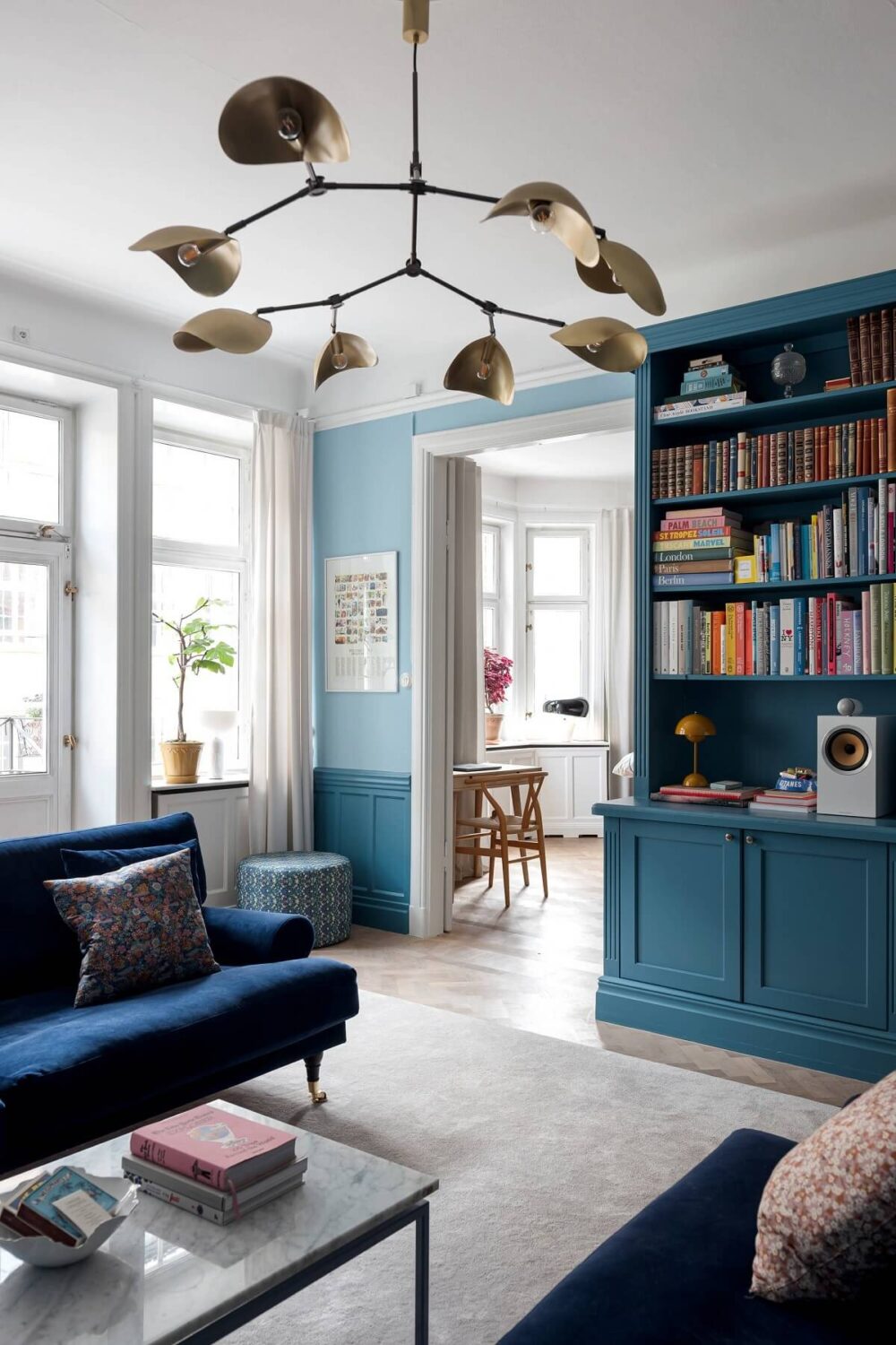 blue living room with built in bookcases and parquet floor nordroom