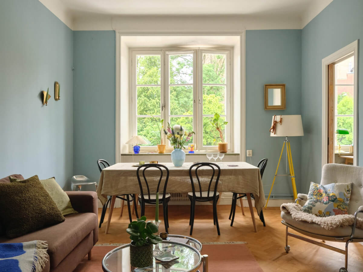 blue living room with dining table