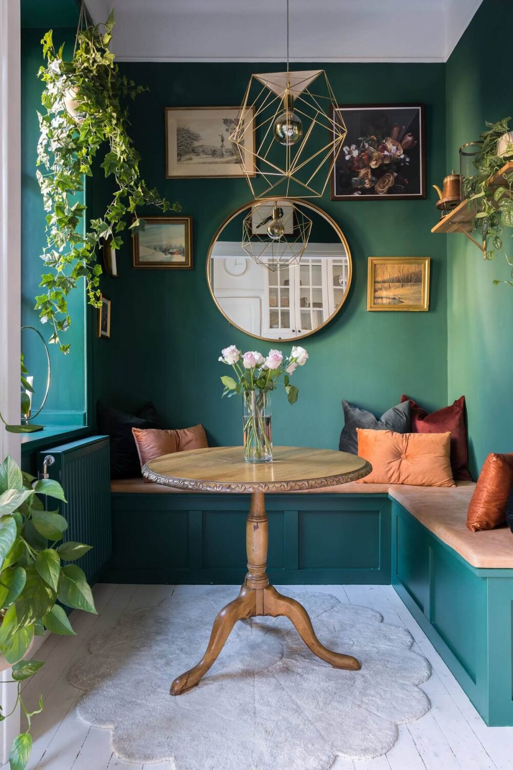 breakfast nook wooden table blue green wall color nordroom Behr Color of the Year 2026: Hidden Gem