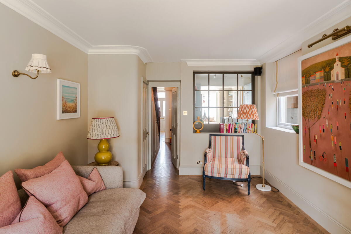 calm sitting room beige walls herringbone parquet floor