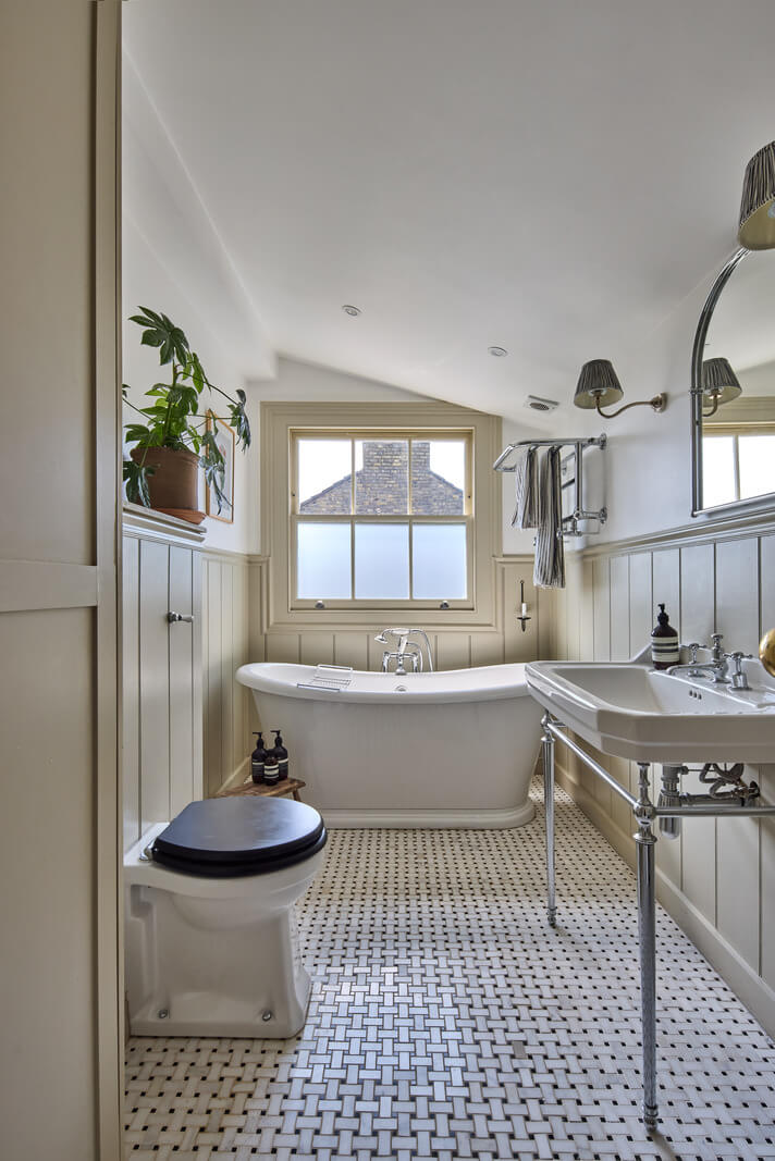 classic bathroom pitched ceiling wall paneling freestanding bath
