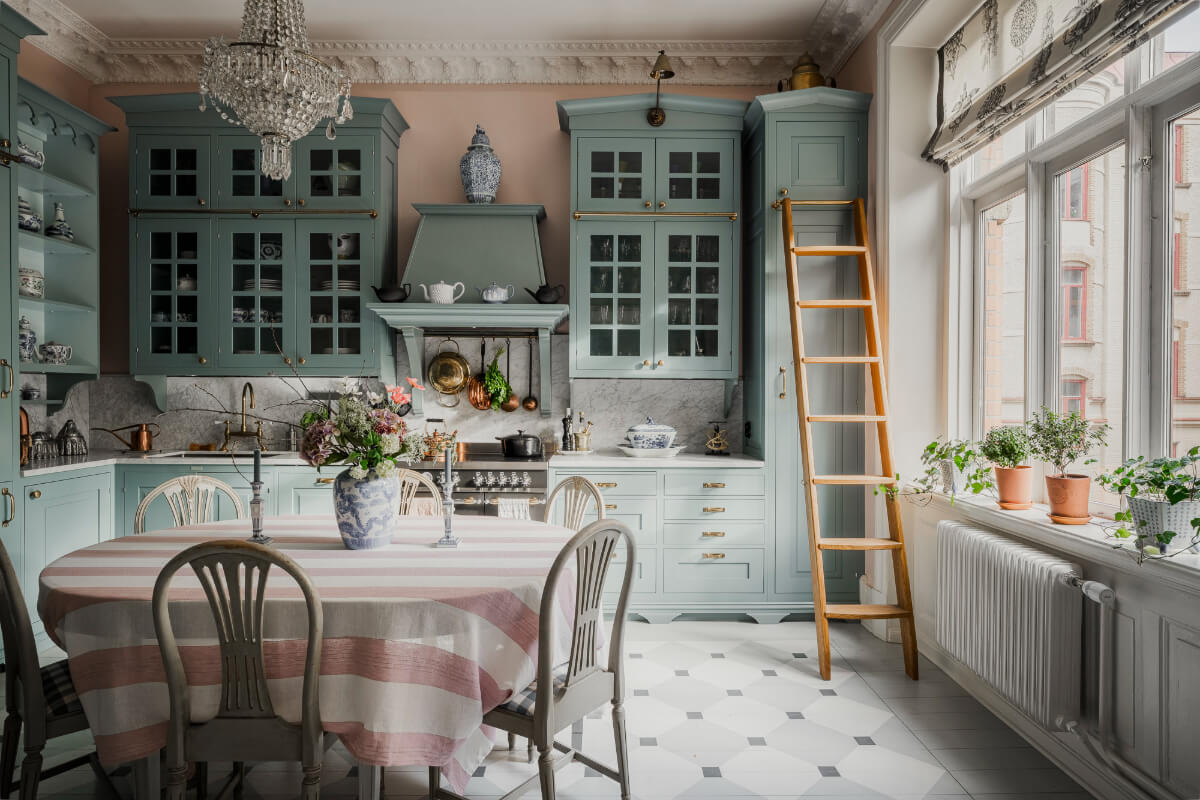 classic kitchen blue cabinets pink walls dining table