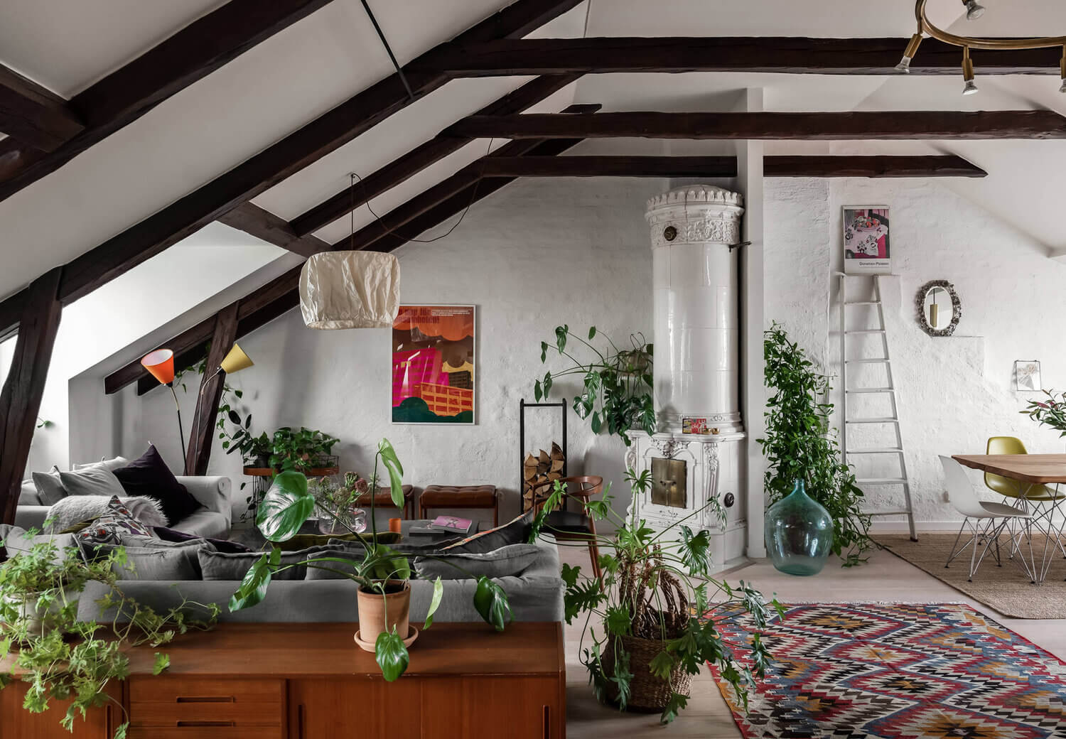 colorful rug penthouse plants scandinavian nordroom A Scandinavian Penthouse Apartment With A Dark Green Kitchen