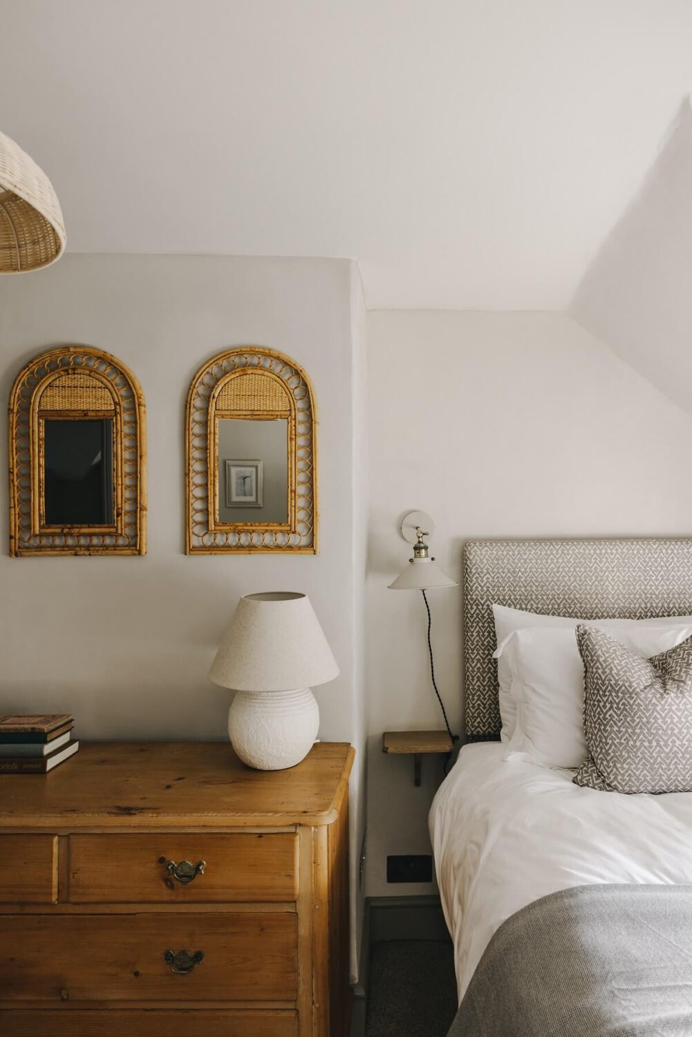 cottage-bedroom-wooden-drawers-slanted-ceiling
