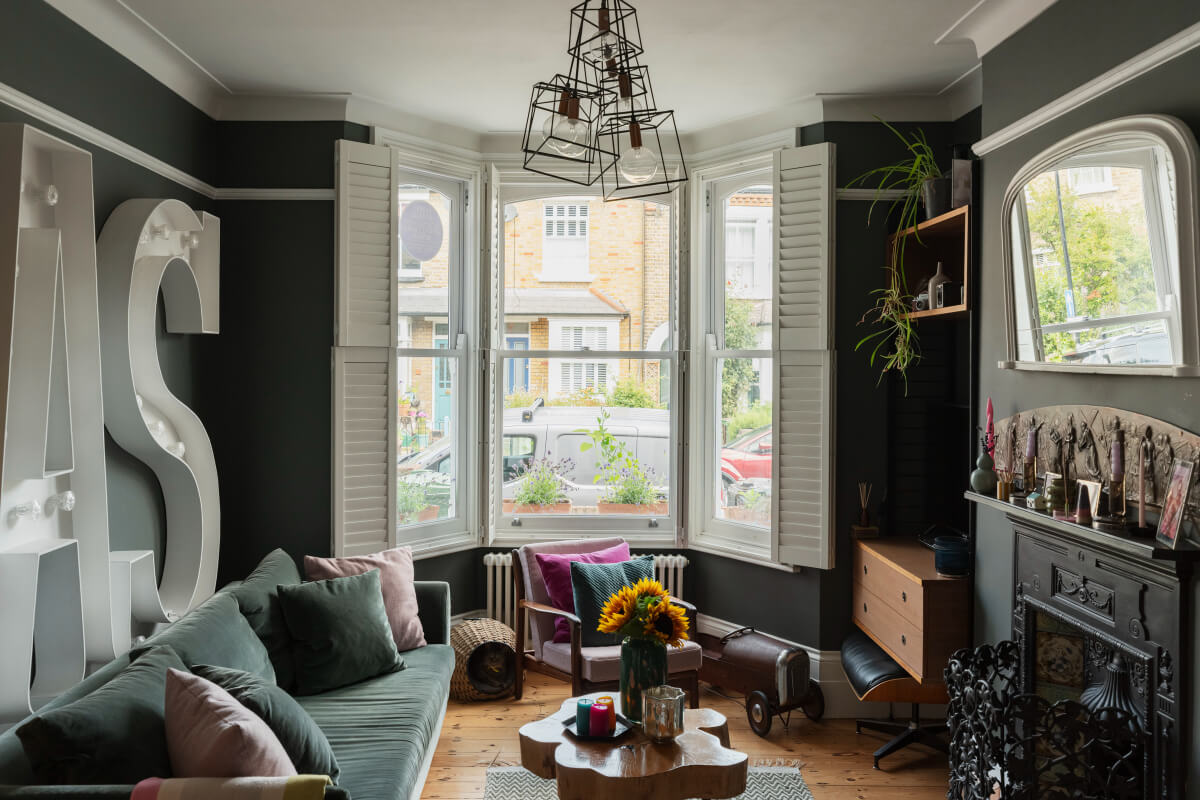 dark gray sitting room bay window fireplace