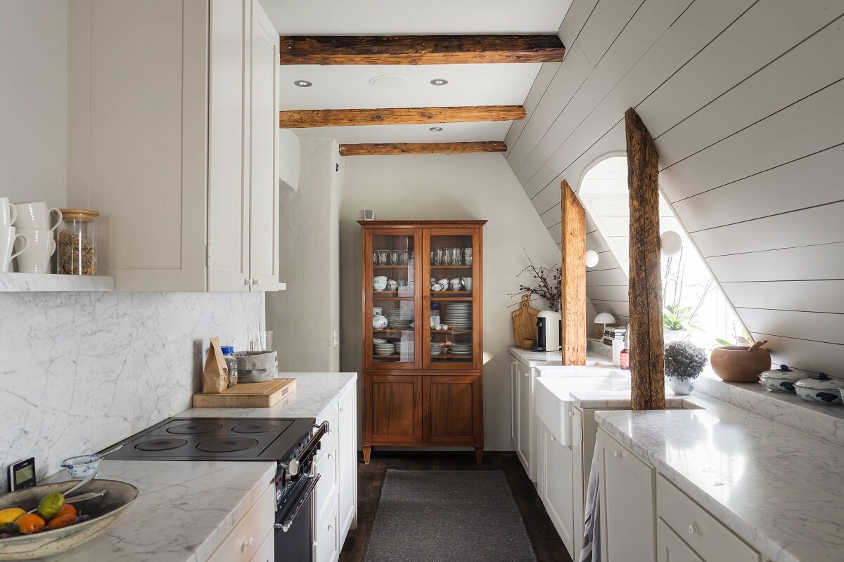 gray galley kitchen slanted ceiling wooden beams