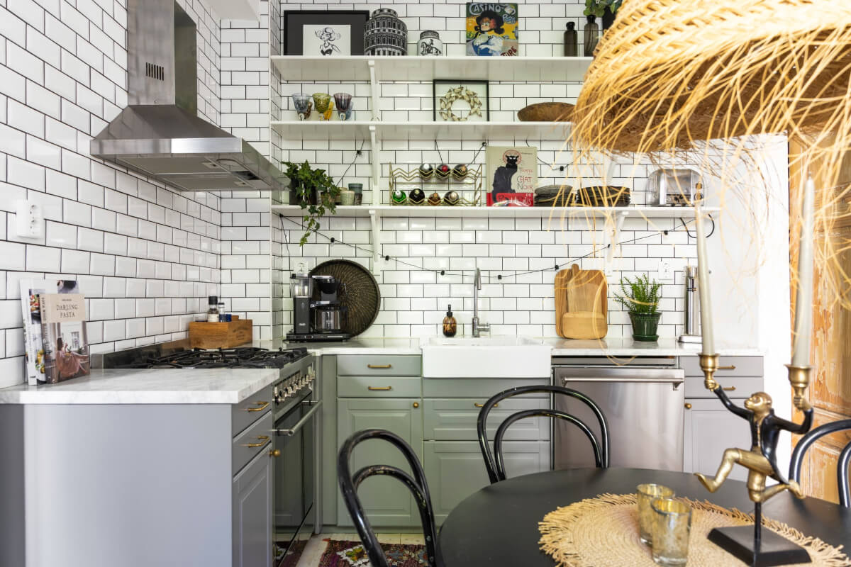 gray kitchen with marble countertop metro tiles and shelves