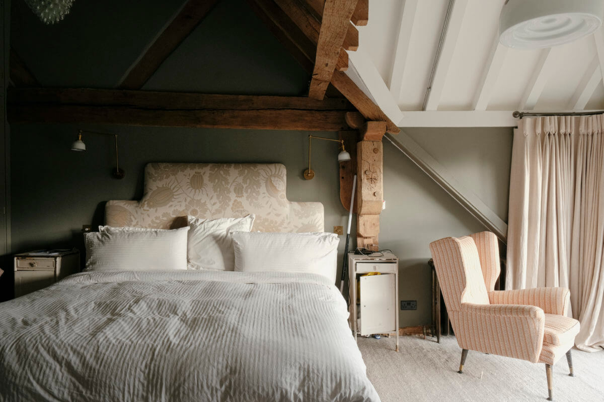 green bedroom with wood framework