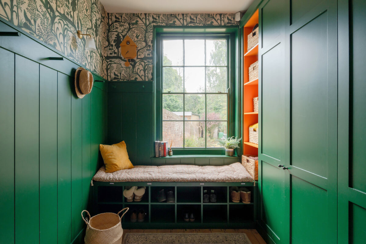 green boot room with paneled walls wallpaper