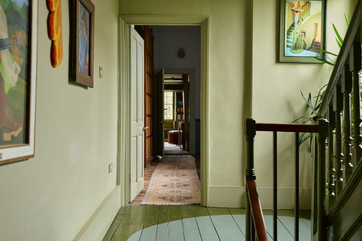 green hall with painted floorboards