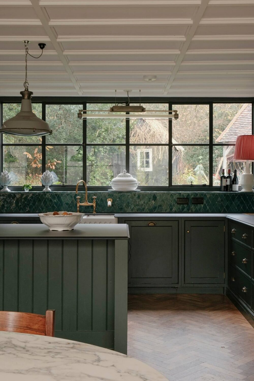 green kitchen cabinets and tiles with industrial style windows