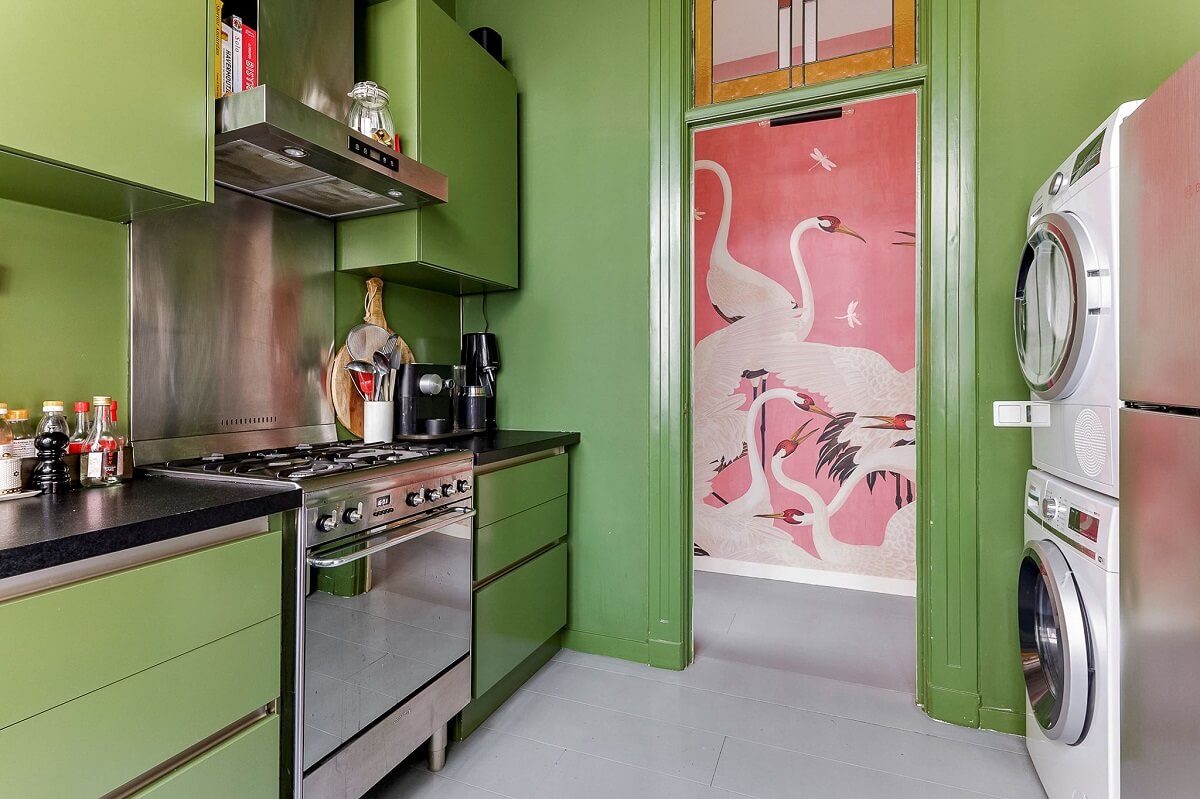green kitchen with washer dryer