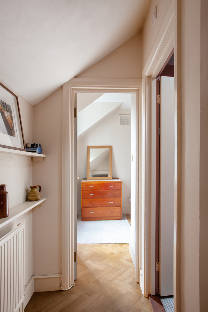 hall herringbone parquet floor Pastel Tones and Midcentury Design in a Top Floor London Apartment
