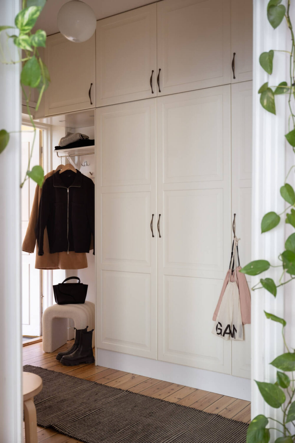 hall with floor to ceiling wardrobes