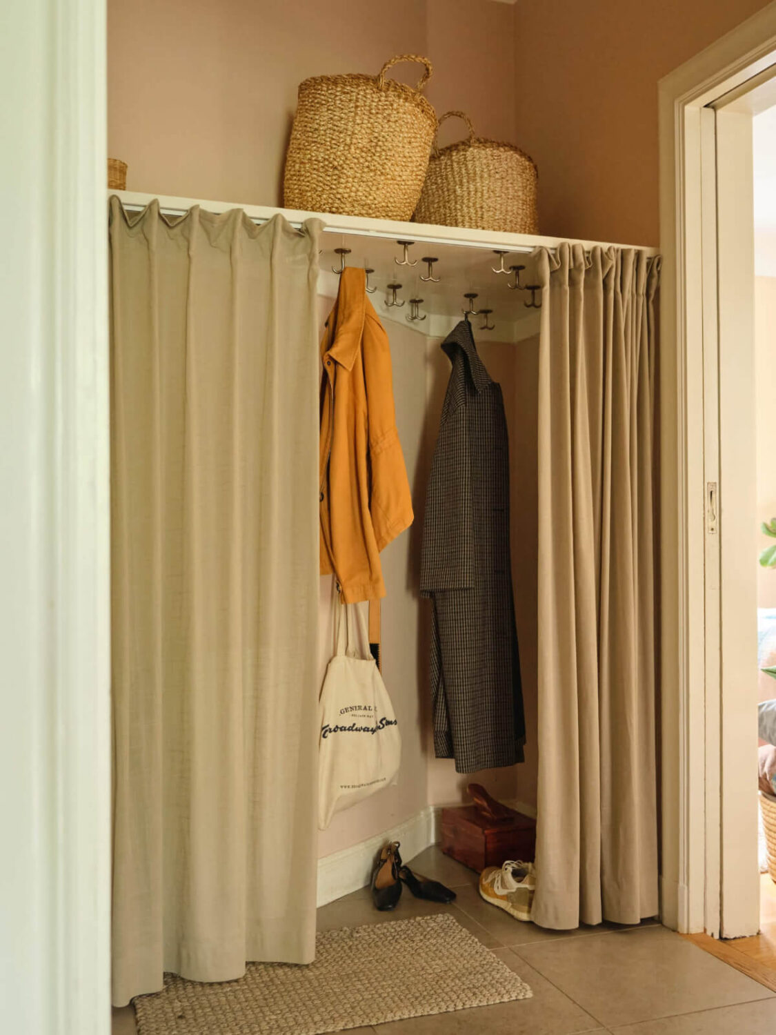 hall with storage behind curtain