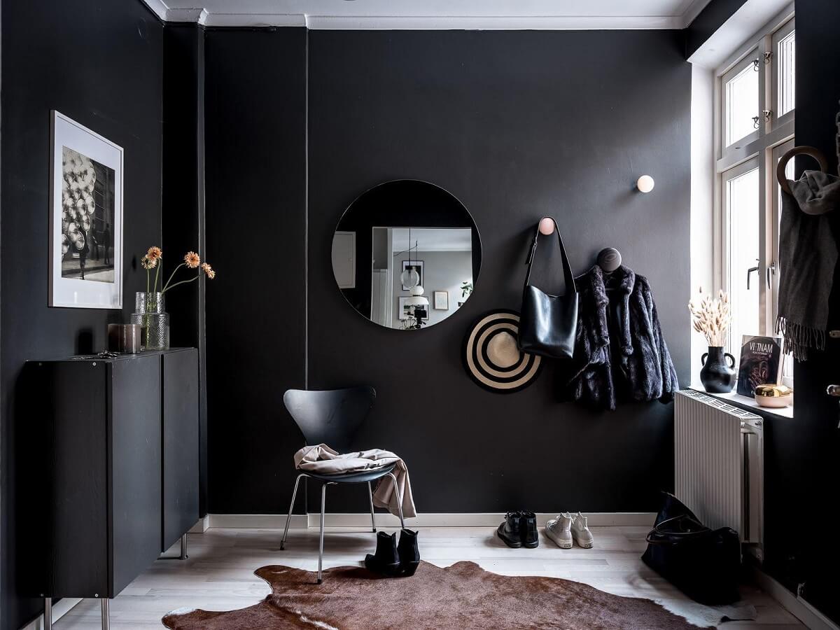 hallway black walls round mirror nordroom