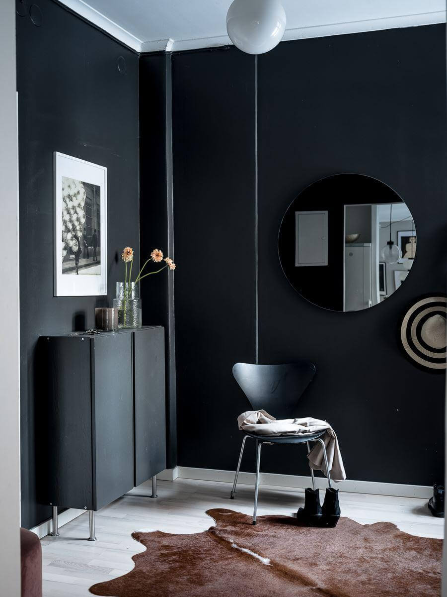 hallway with black walls round mirror ikea ivar cabinets nordroom
