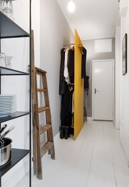 hallway with custom yellow coat storage nordroom