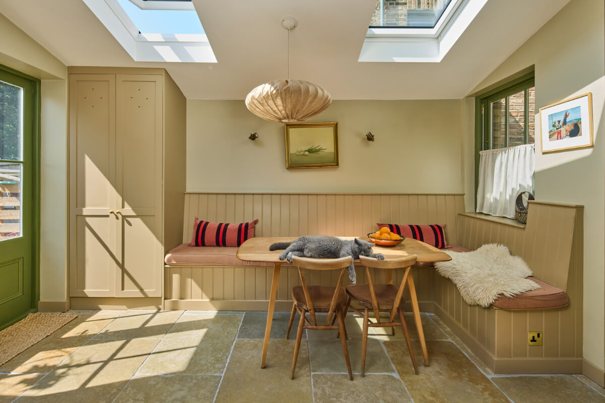 kitchen dining space with cat on table