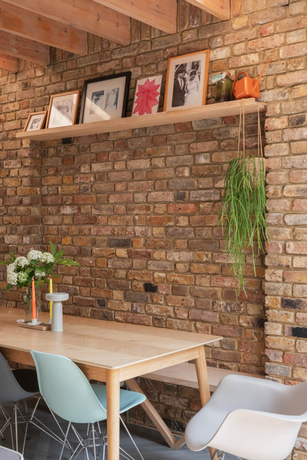 kitchen dining table with bench exposed brick wall