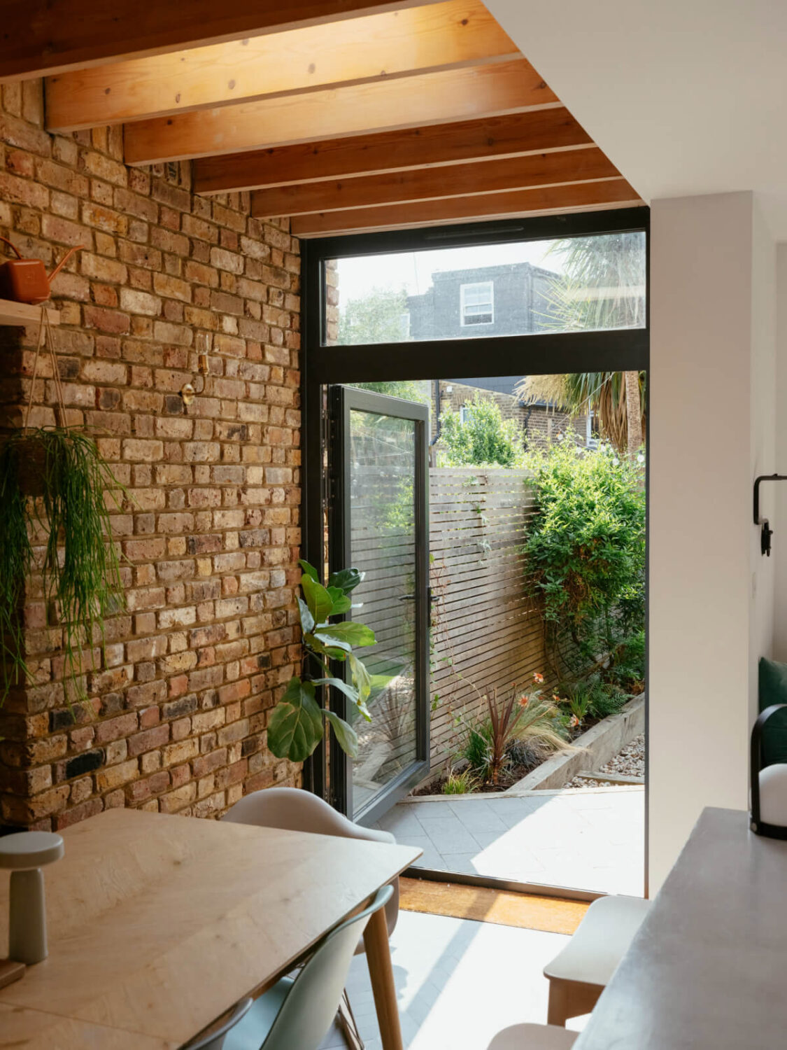 kitchen extension exposed brick wall garden doors