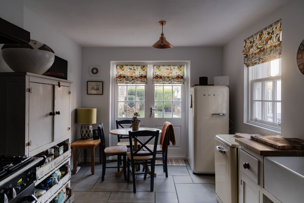 kitchen stone floor round wooden table