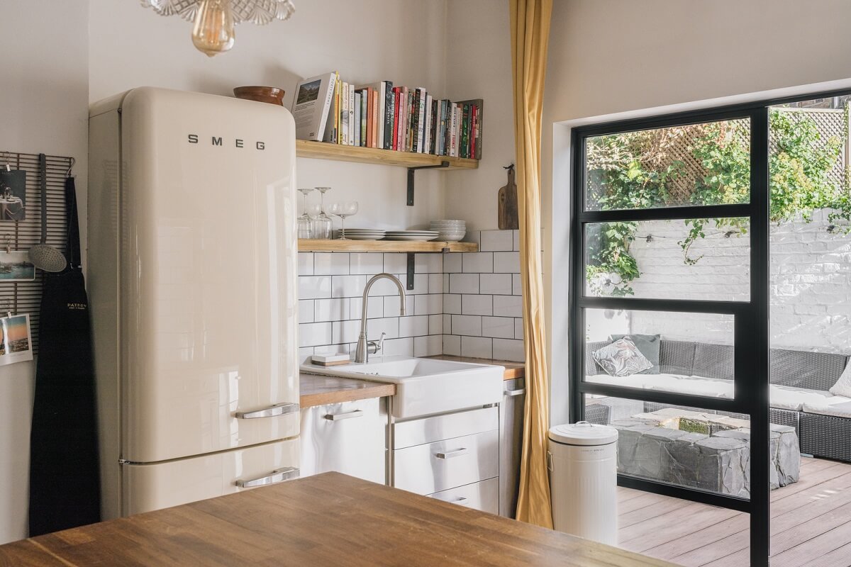 kitchen with white tiles shelves and stainless steel cabinets