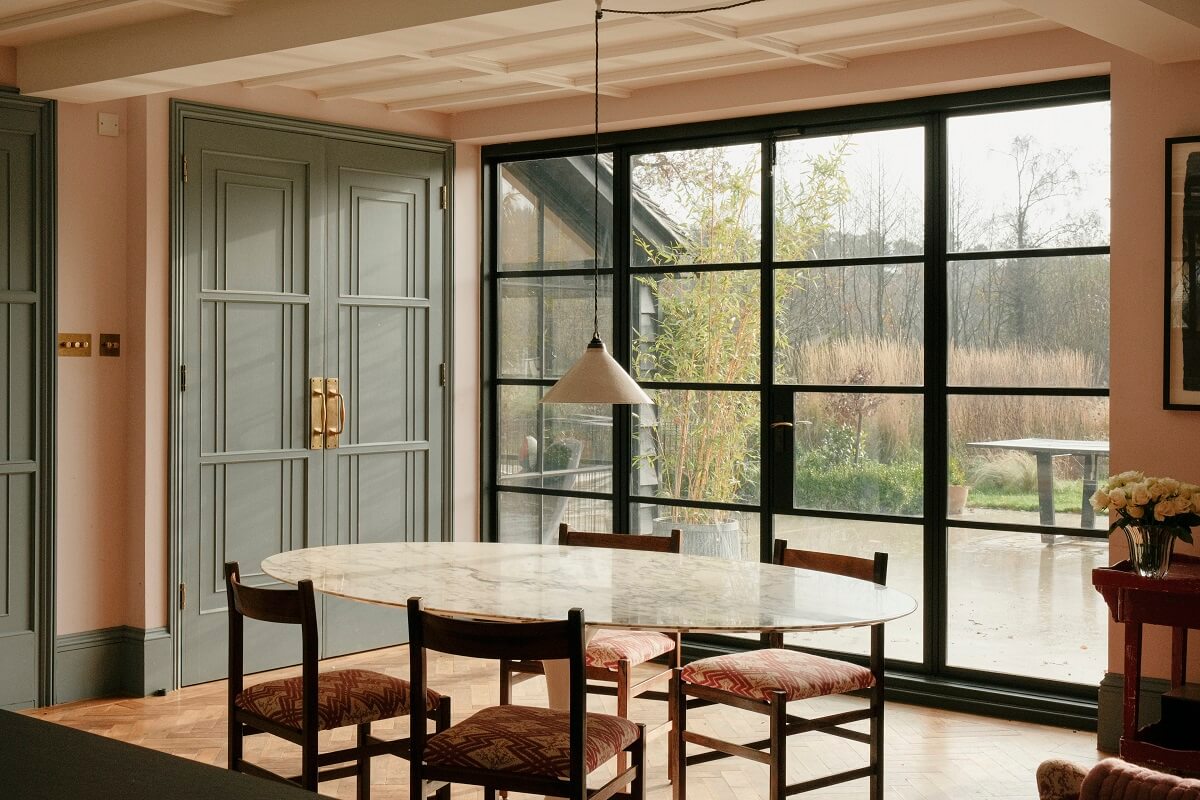 large crittal windows and dining table