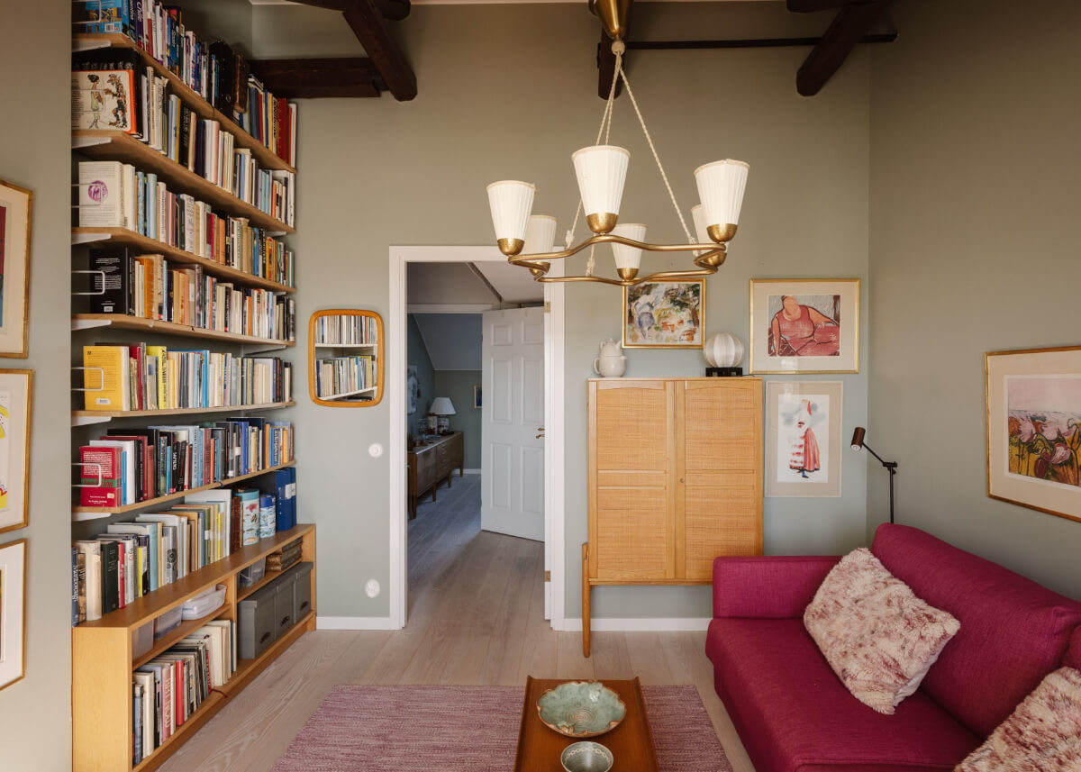 library room pink sofa Revisiting a Spectacular Stockholm Penthouse with Exposed Beams