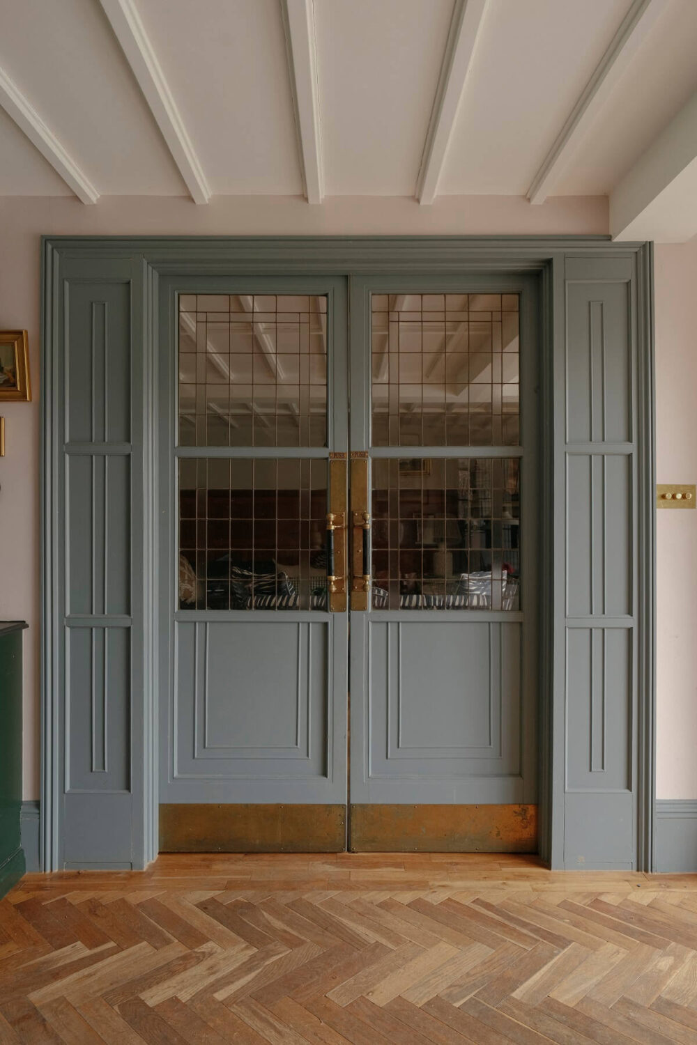light blue glass and wood sliding doors with brass features