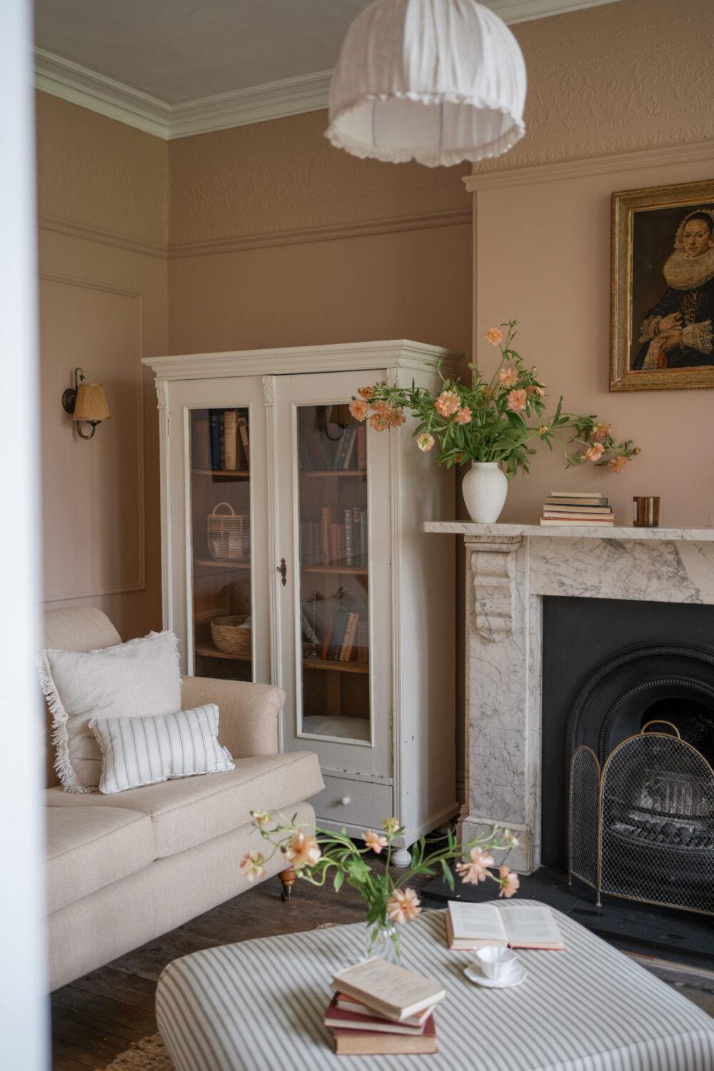 light brown living room with marble fireplace Pantone Color of the Year 2025: Mocha Mousse Interior Inspiration